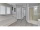 This light and bright bathroom boasts a soaking tub, shower, and stylish finishes at 4759 Silver Hill Dr, Greenwood, IN 46142