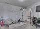 Bright ' bedroom with gray walls, playful decor, unique baseball chair, and open doorway at 4759 Silver Hill Dr, Greenwood, IN 46142