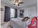 Cozy bedroom featuring a ceiling fan, a built-in closet, and a window with darkening curtains at 4759 Silver Hill Dr, Greenwood, IN 46142