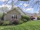 Charming home with lush lawn, mature shrubbery, and brick exterior at 4759 Silver Hill Dr, Greenwood, IN 46142