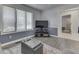 Cozy sitting area with plush furniture, modern decor, and natural light from large windows at 4759 Silver Hill Dr, Greenwood, IN 46142