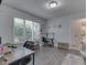 This office has a large window, natural light, desk, and calming decor at 4759 Silver Hill Dr, Greenwood, IN 46142
