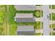 Overhead view of residential properties featuring well-kept lawns and tidy landscaping at 4809 Ozark Ln, Indianapolis, IN 46239