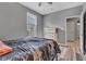 This cozy bedroom features neutral paint, hardwood floors and an open doorway at 4809 Ozark Ln, Indianapolis, IN 46239