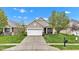 Charming single-story home with a well-manicured lawn and inviting two-car garage at 4809 Ozark Ln, Indianapolis, IN 46239