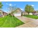 Beautiful single-story home features a well-manicured lawn and a two-car attached garage at 4809 Ozark Ln, Indianapolis, IN 46239