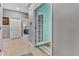 Hallway with grey walls and light-colored tile flooring at 4809 Ozark Ln, Indianapolis, IN 46239