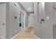 Hallway leading to front door and living room, with tile flooring at 4809 Ozark Ln, Indianapolis, IN 46239