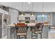 Charming kitchen with stainless appliances, granite counters, and island seating at 4809 Ozark Ln, Indianapolis, IN 46239