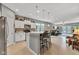 Open-concept kitchen with island seating flows into a living area, great for entertaining at 4809 Ozark Ln, Indianapolis, IN 46239