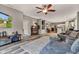 Cozy living room featuring modern decor, a ceiling fan, plush rug, and an open layout at 4809 Ozark Ln, Indianapolis, IN 46239