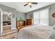Bright and open main bedroom featuring a ceiling fan and access to a living room at 4809 Ozark Ln, Indianapolis, IN 46239