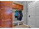 Welcoming mudroom with built-in storage cabinets and bench seating offers a functional and organized space at 4809 Ozark Ln, Indianapolis, IN 46239