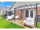 Outdoor patio featuring a pergola, and furniture, perfect for relaxation and entertaining on a lush lawn at 4809 Ozark Ln, Indianapolis, IN 46239