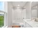 Bathroom featuring a shower-tub combination with a white shower surround and a sink with white countertop at 4844 Morenci Ct, New Palestine, IN 46163