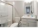 Bright bathroom featuring a walk-in shower and vanity with a modern sink and a neutral color palette at 4844 Morenci Ct, New Palestine, IN 46163