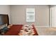 Clean bedroom with carpet, window, and door at 4844 Morenci Ct, New Palestine, IN 46163