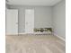 Spacious carpeted bedroom with two doors and a picture on the floor at 4844 Morenci Ct, New Palestine, IN 46163