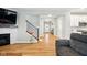 Open-concept living space showcasing fireplace, staircase, and seamless flow into other living areas at 4844 Morenci Ct, New Palestine, IN 46163