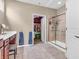Bathroom featuring tiled walk-in shower, vanity and walk-in closet at 4857 Silverbell Dr, Plainfield, IN 46168