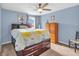 Bedroom with blue walls, carpet, ceiling fan and large bed at 4857 Silverbell Dr, Plainfield, IN 46168
