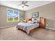 Relaxing bedroom with neutral tones, carpeted floors, and a large window at 4857 Silverbell Dr, Plainfield, IN 46168