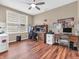 Bedroom featuring hard wood floors, ceiling fan, and dual work stations at 4857 Silverbell Dr, Plainfield, IN 46168