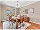 The dining room features a table set for six with an ornate, patterned area rug at 4857 Silverbell Dr, Plainfield, IN 46168