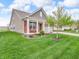 Charming home featuring a welcoming front porch, a two-car garage, and a beautifully landscaped yard at 4857 Silverbell Dr, Plainfield, IN 46168