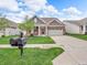 Attractive home with a well-manicured lawn, a front porch, and a convenient two-car garage at 4857 Silverbell Dr, Plainfield, IN 46168