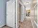 Hallway featuring neutral walls, carpet, and white doors at 4857 Silverbell Dr, Plainfield, IN 46168
