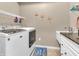 Laundry room with washing machine, dryer, and utility sink at 4857 Silverbell Dr, Plainfield, IN 46168