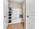 Mudroom featuring shelving, hooks, and bench with a colorful pillow at 4857 Silverbell Dr, Plainfield, IN 46168