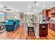 Bright open-concept living area with hardwood floors, kitchen island, and inviting seating at 4857 Silverbell Dr, Plainfield, IN 46168