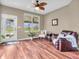 Cozy sunroom features a seating area and views of the community pond and surrounding homes at 4857 Silverbell Dr, Plainfield, IN 46168