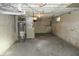 Unfinished basement with concrete floor, utility equipment, and exposed ceiling at 509 N Emerson Ave, Indianapolis, IN 46219