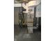 Basement mechanicals featuring a water heater and furnace system at 509 N Emerson Ave, Indianapolis, IN 46219