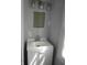Small bathroom includes a white vanity, neutral paint and updated light fixture at 509 N Emerson Ave, Indianapolis, IN 46219