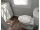 Clean, bright bathroom features a modern toilet, neutral paint, and white vanity at 509 N Emerson Ave, Indianapolis, IN 46219
