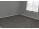 Cozy bedroom features neutral walls, plush carpeting, and a bright window at 509 N Emerson Ave, Indianapolis, IN 46219