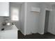 Kitchen featuring white cabinets, marble countertop and stainless steel sink with modern faucet at 509 N Emerson Ave, Indianapolis, IN 46219
