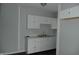 Kitchen area showcasing white cabinets, marble countertop and stainless steel sink at 509 N Emerson Ave, Indianapolis, IN 46219
