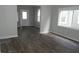 Bright living room features updated dark floors, modern color palette, and a view of the entry at 509 N Emerson Ave, Indianapolis, IN 46219