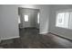 Inviting living room with modern, neutral decor, wood-look flooring and plenty of natural light at 509 N Emerson Ave, Indianapolis, IN 46219