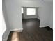 Open-concept living room with dark wood flooring and ample natural light at 509 N Emerson Ave, Indianapolis, IN 46219