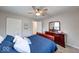 Comfortable bedroom featuring a ceiling fan, closet and stylish furniture and decor at 517 S 4Th Ave, Beech Grove, IN 46107