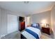 Comfortable bedroom with carpeting, closet space and warm decor at 517 S 4Th Ave, Beech Grove, IN 46107