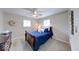 Bedroom with ceiling fan, two windows, carpet flooring and ample closet space at 517 S 4Th Ave, Beech Grove, IN 46107