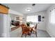 Cozy dining area adjacent to living area with charming table and chairs at 517 S 4Th Ave, Beech Grove, IN 46107