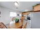 Eat-in kitchen features stainless appliances, tile floors, and oak cabinets at 517 S 4Th Ave, Beech Grove, IN 46107